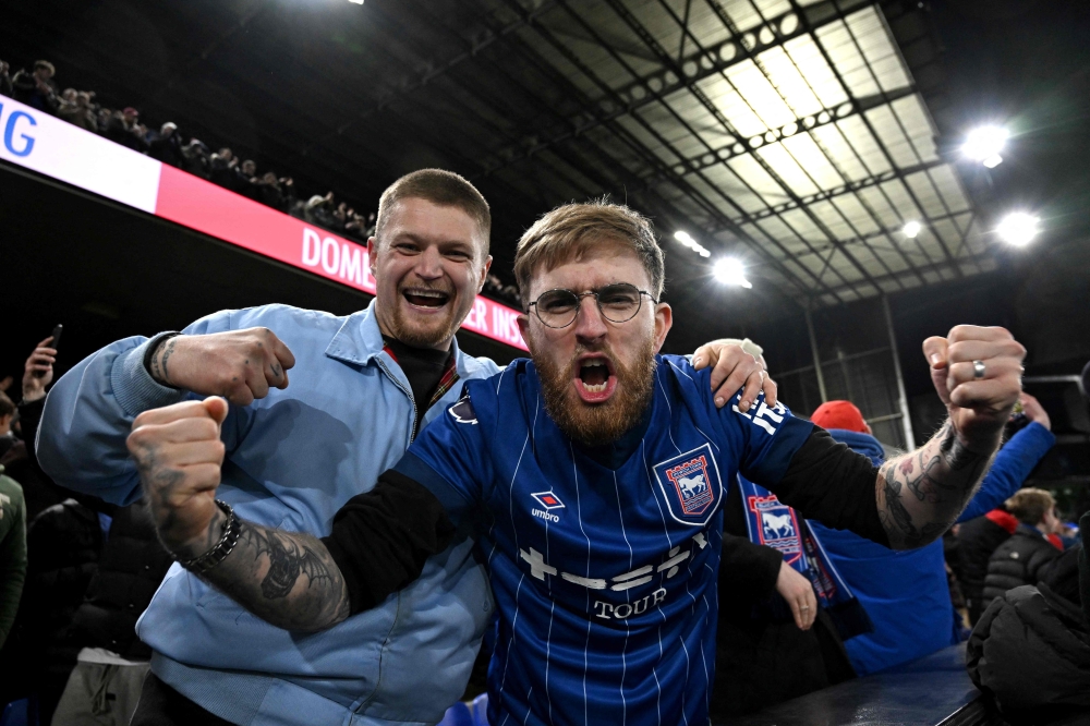 Ipswich celebrate after the match. — AFP