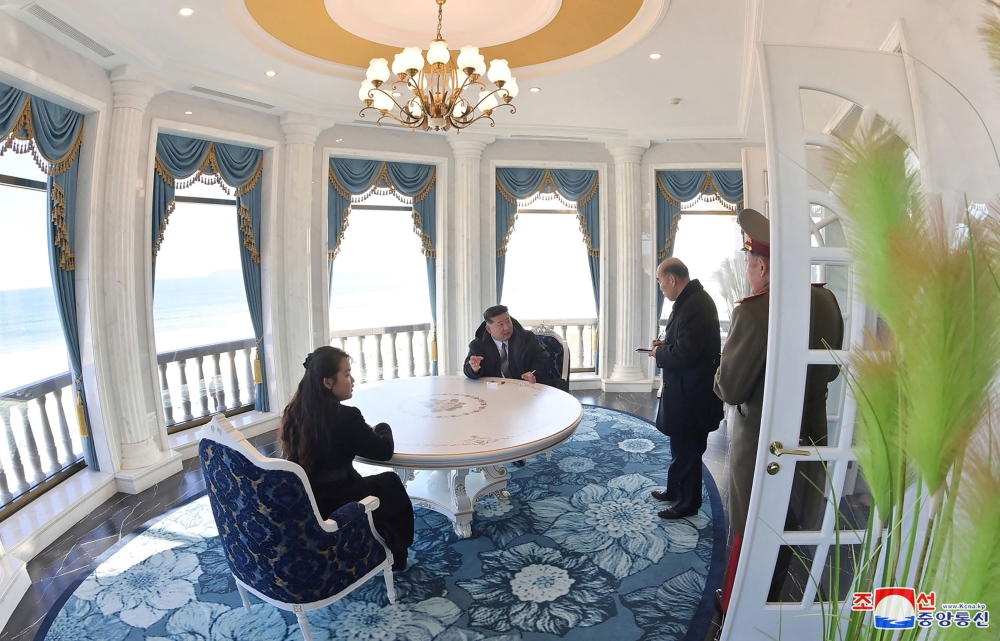 This picture taken on December 29 shows North Korea’s leader Kim Jung-un and his daughter, Ju-ae inspecting a hotel during a visit to the ‘Kalma Coast Tourism Area’ in the North Korean city of Wonsan, Kangwon Province. — AFP pic/KCNA via KNS