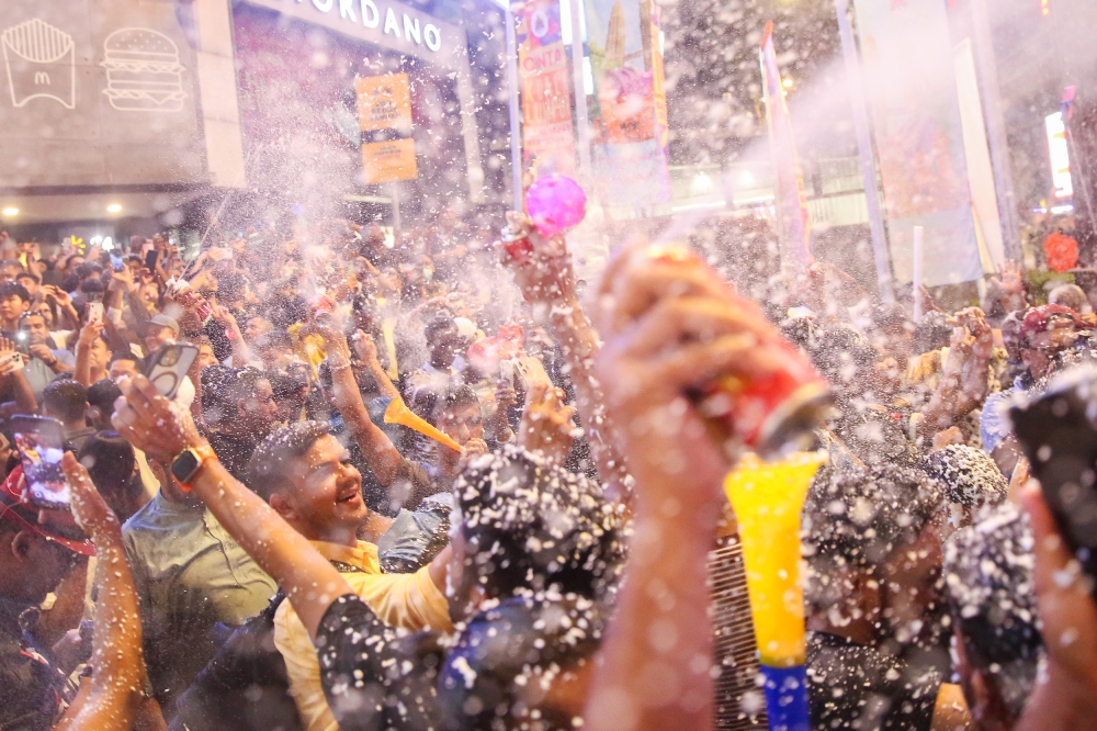 Revellers throng the streets in Bukit Bintang to celebrate New Year in Kuala Lumpur on Jan 1, 2025. — Picture by Choo Choy May .