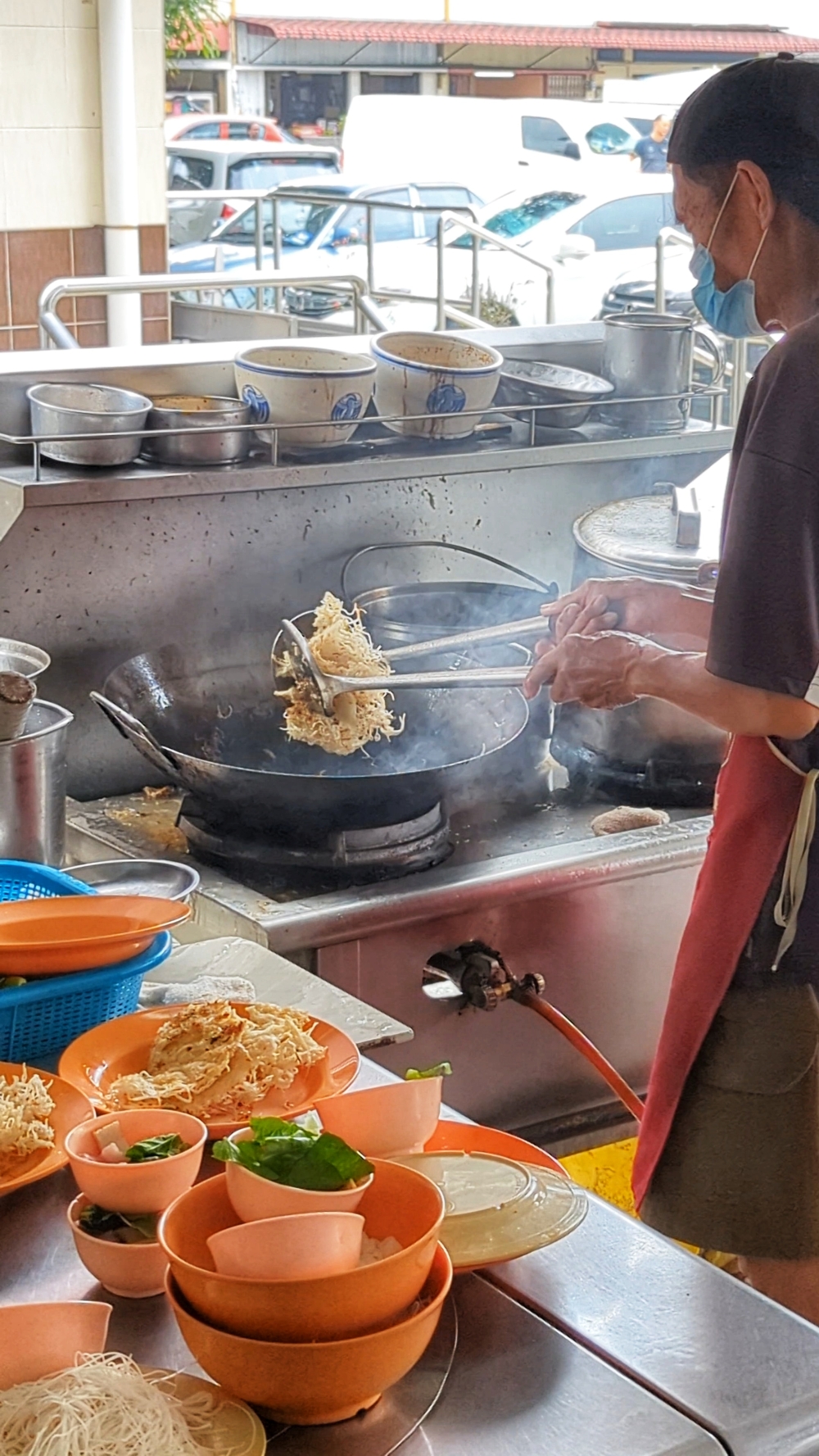 The rice noodles are fried to a crisp before it is cooked with the sauce. — Picture by Ethan Lau