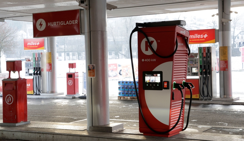 At fuel stations, more and more petrol pumps are replaced with fast electric chargers. — Reuters pic