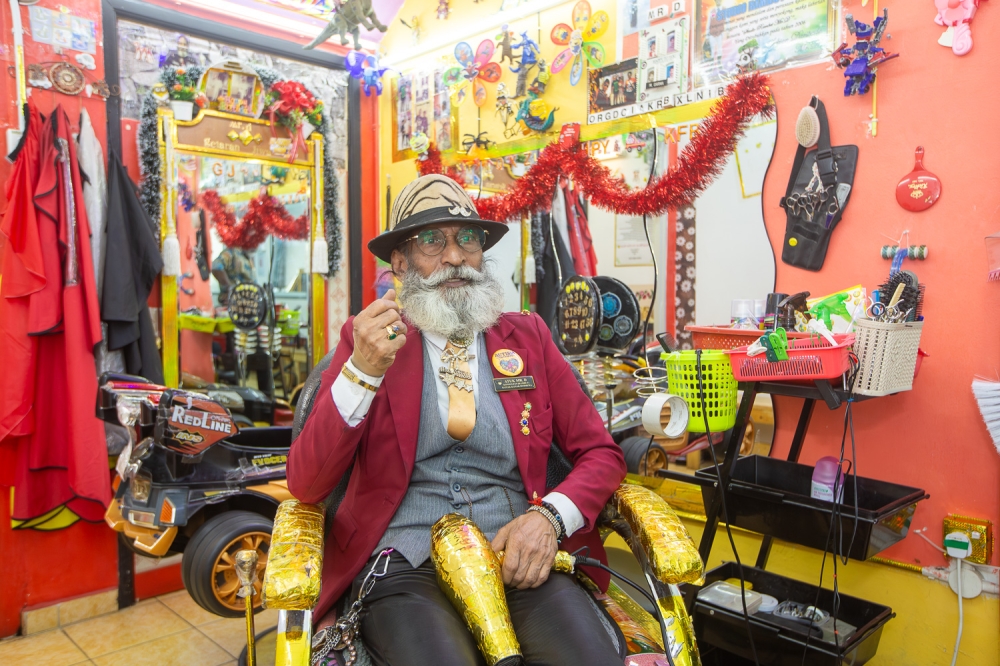 Darmalingam has a colourful corner dedicated to children with autism in his salon to make them feel at home. — Picture by Raymond Manuel