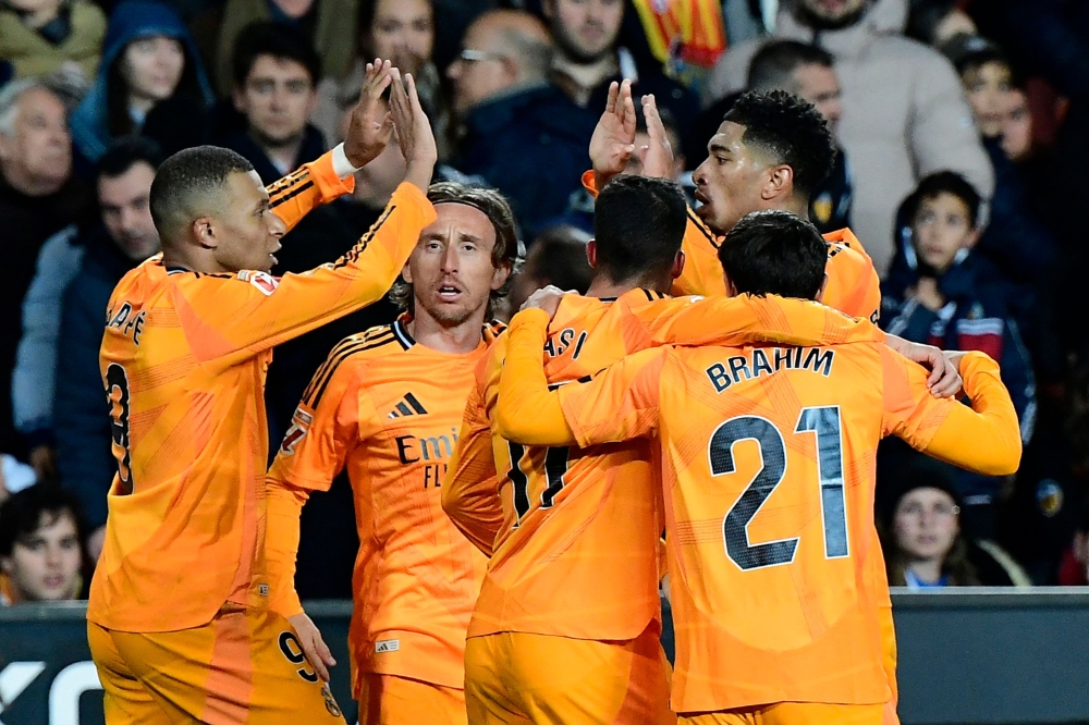 Real Madrid's Jude Bellingham celebrates with teammates. — AFP