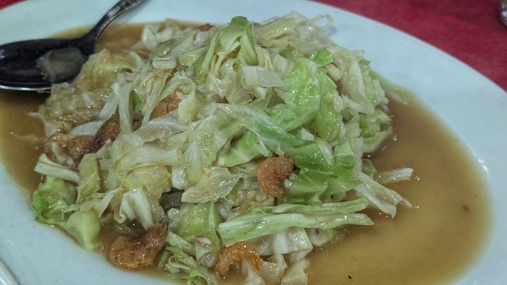 The stir-fried cabbage that stole the show. — Picture by Ethan Lau

