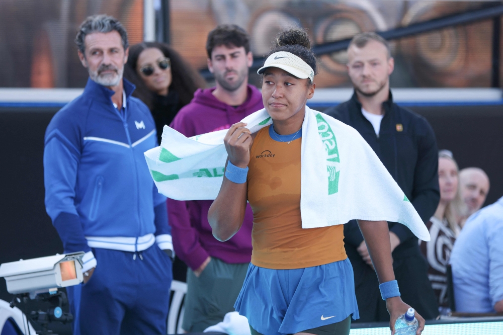 Naomi Osaka of Japan reacts after withdrawing against Clara Tauson of Denmark from their women's singles final match at the WTA Auckland Classic tennis tournament in Auckland January 5, 2025. — AFP pic