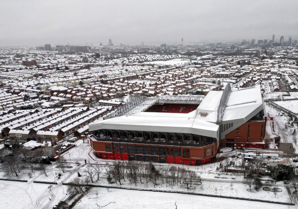 An aerial photograph taken on January 5, 2025 shows Anfield stadium in Liverpool, north west England, covered in snow ahead of the the English Premier League football match between Liverpool and Manchester United, as heavy snow across parts of England are set to cause disruption. — AFP pic