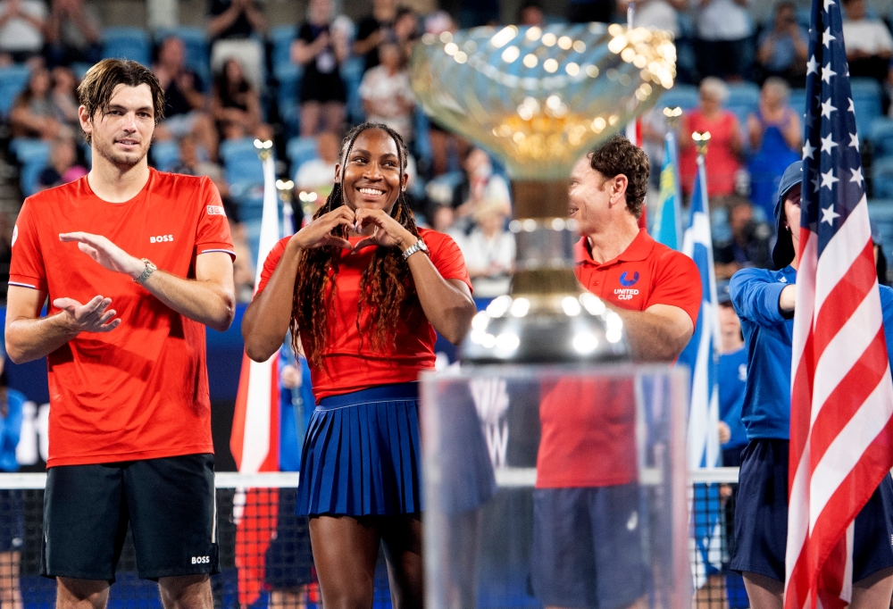 Coco Gauff of the US poses on the podium along with Taylor Fritz and captain Michael Russell before lifting the United Cup trophy following their victory in the final against Poland at the Ken Rosewall Arena, Sydney January 4, 2025. — Reuters pic  