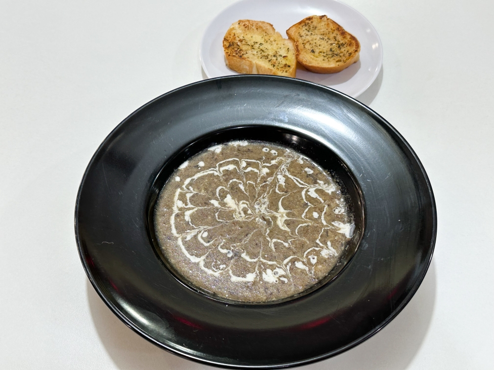 Cream of Mushroom Soup is also available with garlic bread. — Picture by Lee Khang Yi

