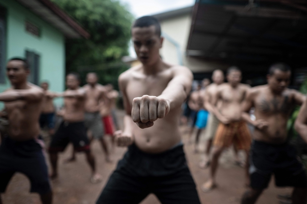 This photo taken on December 14, 2024 shows recovering drug addicts exercising during a rehabilitation program at the Metta Saneain drug addict rehab centre in Yangon. — AFP pic