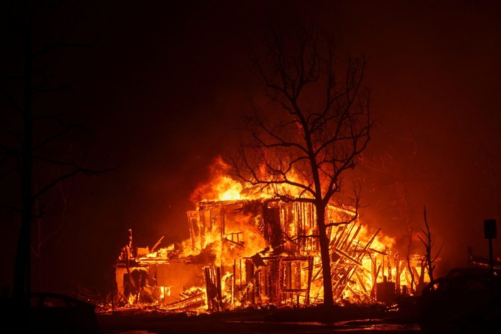 Flames engulf a structure as the Eaton Fire burns in Pasadena, California, US January 7, 2025. — Reuters pic