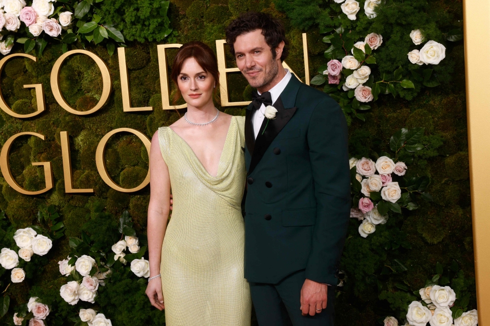 Adam Brody and Leighton Meester at the Golden Globes last week. — AFP pic