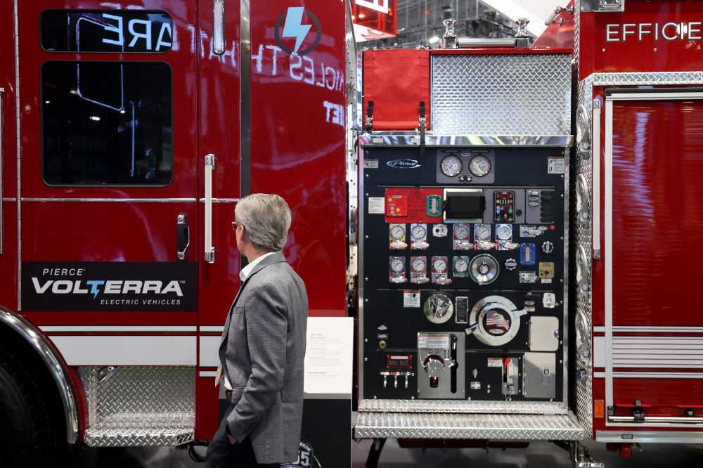 A spectator walks past a Pierce Volterra Electric Pumper, an electric firetruck, at the Oshkosh booth at the Consumer Electronics Show (CES) on January 7, 2025 in Las Vegas. — AFP pic