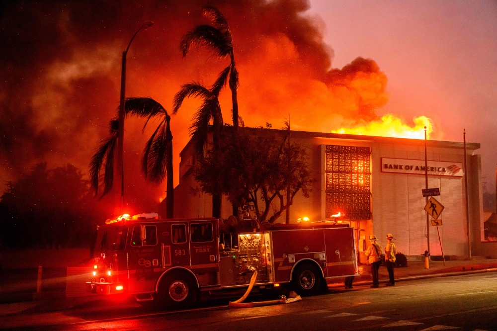 A Bank of America is fully engulfed in flames during the Eaton fire in the Altadena area. — AFP pic