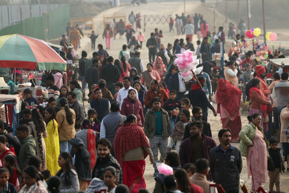 People crowd the eating area outside the Shivalaya park where replicas of twelve Jyotirlinga shrines dedicated to the Hindu deity Shiva have been constructed, on the banks of the Yamuna River, ahead of the upcoming Maha Kumbh Mela festival in Prayagraj on January 8, 2025. — AFP pic