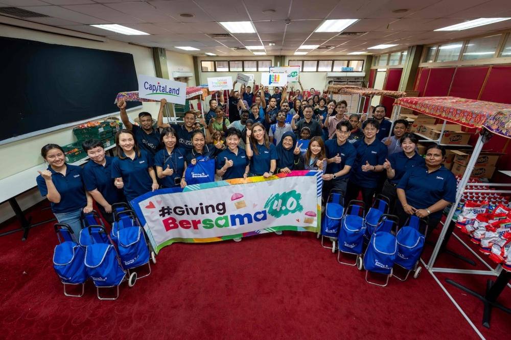 CapitaLand staff volunteers and the representatives from Unit Mutiara Food Bank Penang after setting up the stalls for the shopping mall bazaar. — Picture courtesy of CapitaLand