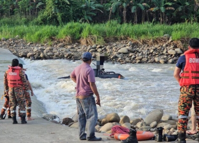 Bomba rescue man stranded on truck roof in Kota Marudu, after vehicle swept away by river currents