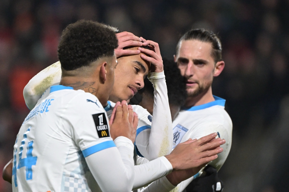 Marseille’s Mason Greenwood (centre) celebrates with teammates after scoring. — AFP