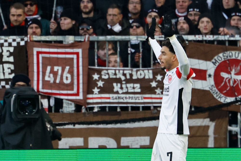 Frankfurt’s Omar Marmoush celebrates scoring during the German first division Bundesliga football match against St Pauli. — AFP