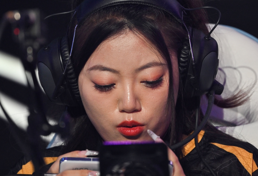 For women esports players in China, mastering the game is only the first hurdle to carving out a space for themselves in the male-dominated field. — AFP pic