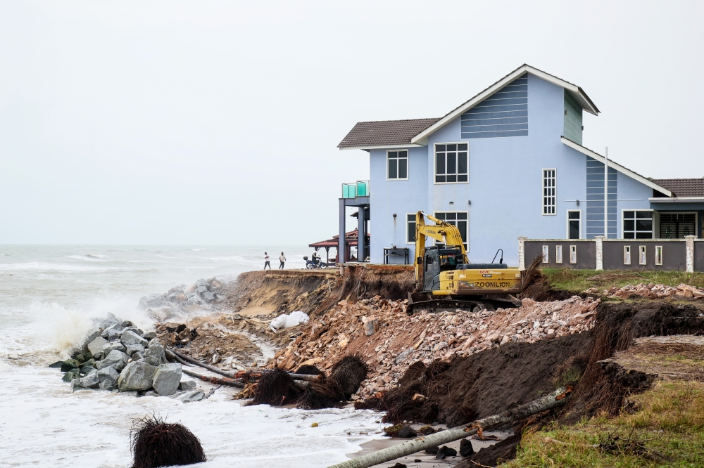 Efforts to place rocks around houses affected by coastal erosion to prevent them from collapsing were observed during an inspection in Kampung Tanjung, Batu Rakit January 11, 2025. — Bernama pic