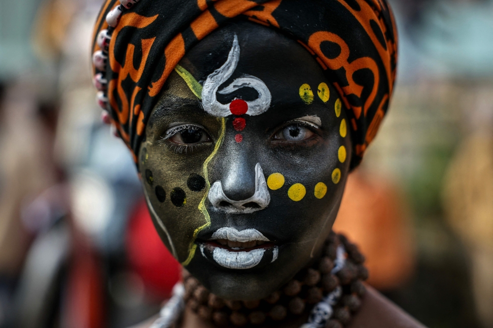 A Hindu devotee looks on as he takes part in a religious procession of Naya Udasin Akhara ahead of the Maha Kumbh Mela festival in Prayagraj January 10, 2025. — AFP pic