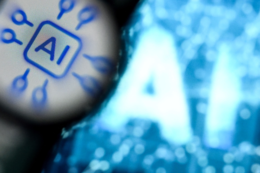 A photo shows the letters AI for Artificial Intelligence on a laptop screen in Frankfurt am Main, western Germany. — AFP pic