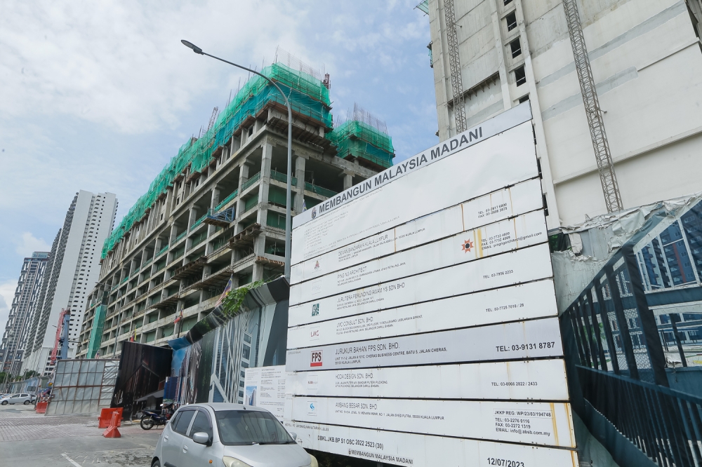 Mah Sing Group’s affordable housing project, part of the larger M Aspira development, raises concerns due to its proximity to the SMART flood retention pond. — Picture by Raymond Manuel