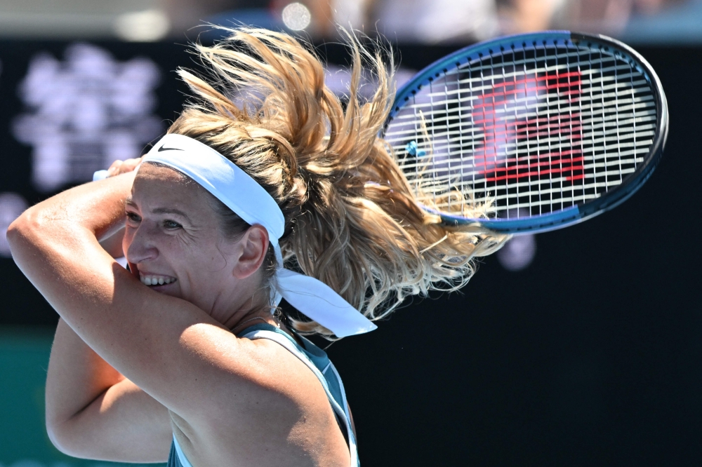 Belarus’ Victoria Azarenka hits a return against Italy’s Lucia Bronzetti during their women’s singles match on day two of the Australian Open in Melbourne January 13, 2025. — AFP pic