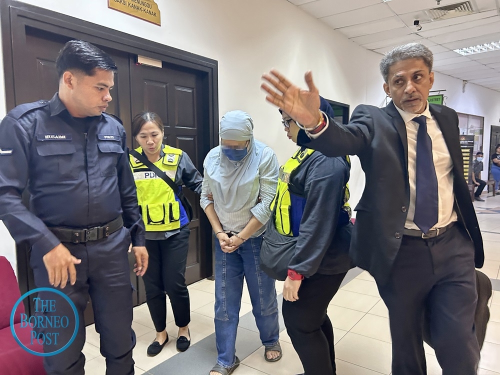 Police escort the managing director accompanied by Shankar January 16, 2025. — The Borneo Post pic