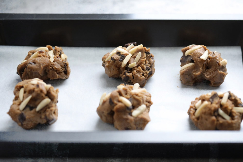 Portion dough onto a baking tray lined with parchment paper — Picture by CK Lim