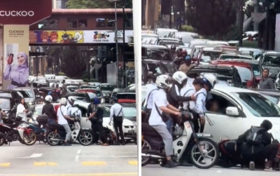 Woman arrested for reckless driving in Bukit Bintang, blocking road, causing accident and nearly hitting traffic cop (VIDEO)