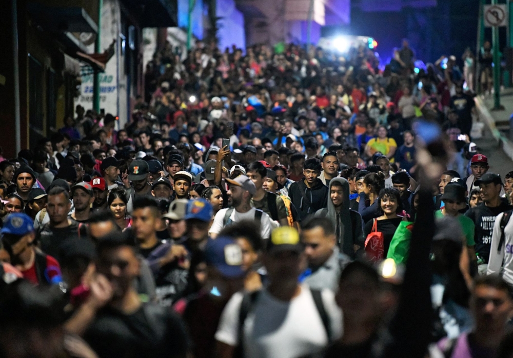 Migrants set off on foot in a caravan from southern Mexico hours before Donald Trump's inauguration. — Pic by AFP