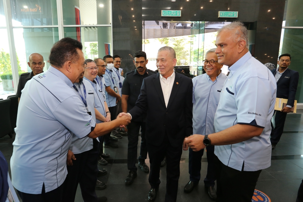 Deputy Prime Minister and Energy Transition and Water Transformation Minister Datuk Seri Fadillah Yusof (second from left) and Narendran (far right) during a working visit at Indah Water Konsortium HQ in 2024. — Picture courtesy of Indah Water Konsortium