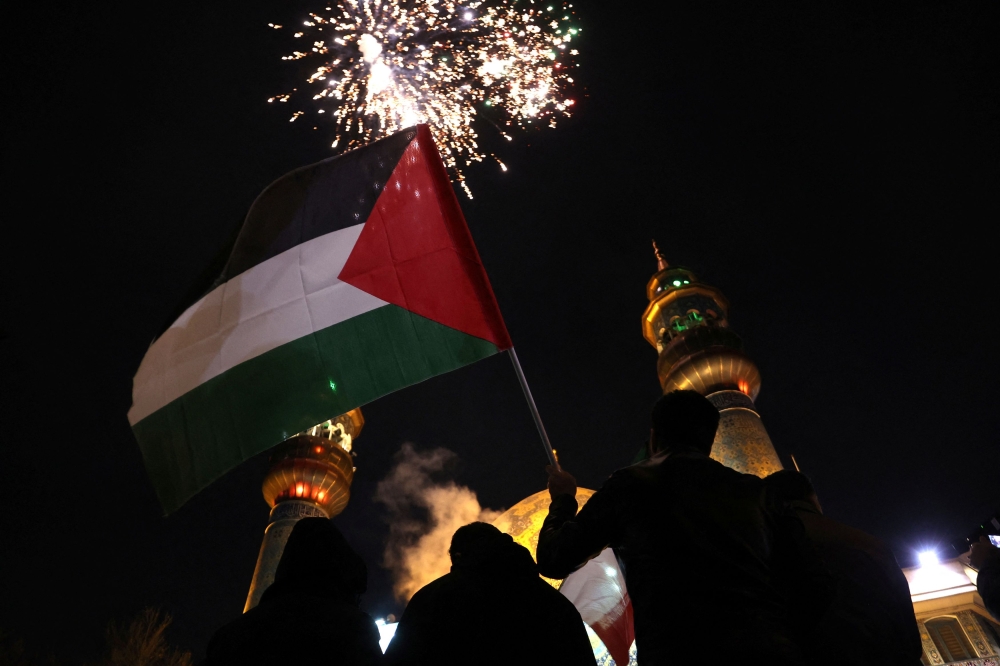 Iranians light fireworks during a celebration following the news of a ceasefire between Hamas and Israel, in Tehran, Iran, January 16, 2025. — Majid Asgaripour/WANA (West Asia News Agency) handout pic via Reuters 