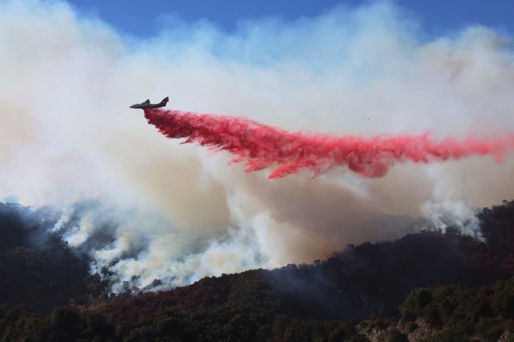 Retardant is dropped as the Palisades Fire grows near Encino Hills, California, on January 11, 2025. 