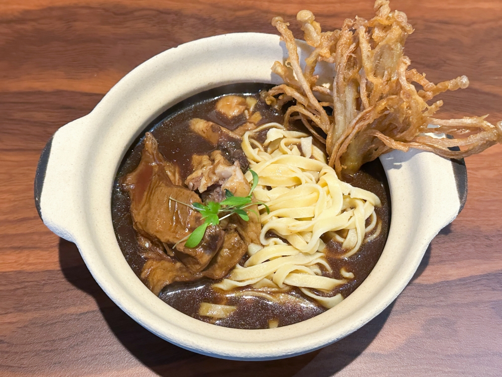 ‘Baaah’ Kut Teh is a riff of meat bone tea with stewed lamb and handmade tagliatelle served with a side crunch of fried enoki — Picture by Lee Khang Yi