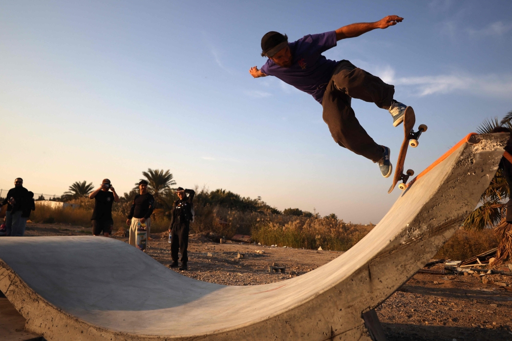 An Iraqi skateboarder performs a trick at a skatepark in Baghdad on February 1, 2025. The community skatepark, which is the first of it's kind in Iraq, opened to the public on February 1, 2025. — AFP pic