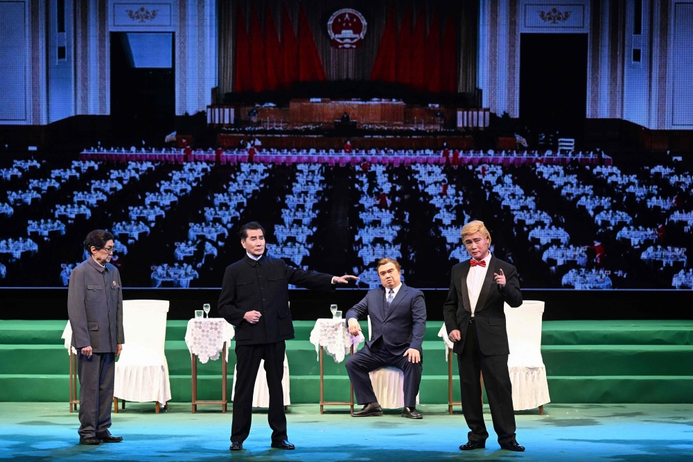 The sold-out show, which runs for nearly four hours, begins with Richard Nixon’s meeting with Mao Zedong in 1972 then spirals into a tale about Trump searching for his lost Chinese twin, with North Korean leader Kim Jong Un making an appearance. — Pic by AFP