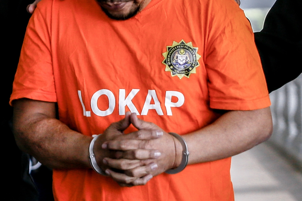 A file photograph shows a person wearing the Malaysian Anti-Corruption Commission’s uniform for detainees. — Picture by Hari Anggara