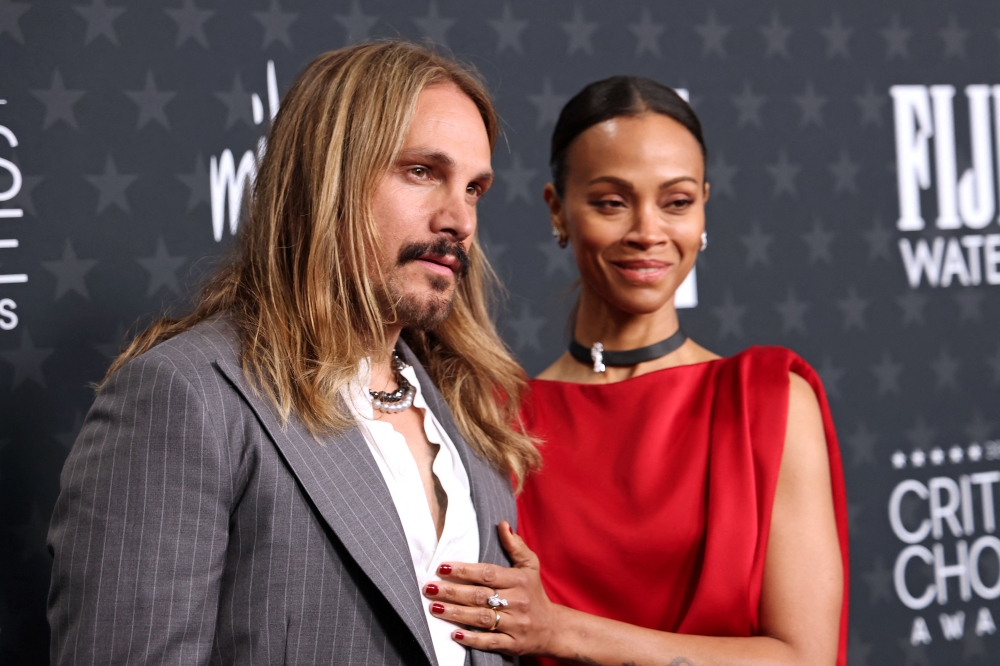 US actress Zoe Saldana (right) and her husband Marco Perego-Saldana attend the 30th Annual Critics Choice Awards at Barker Hangar in Santa Monica, California February 7, 2025. — AFP pic