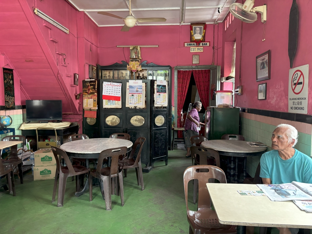 Sinhalese Bar owner Alfred Perera sits at a table in his bar in Ipoh. — Picture by John Bunyan