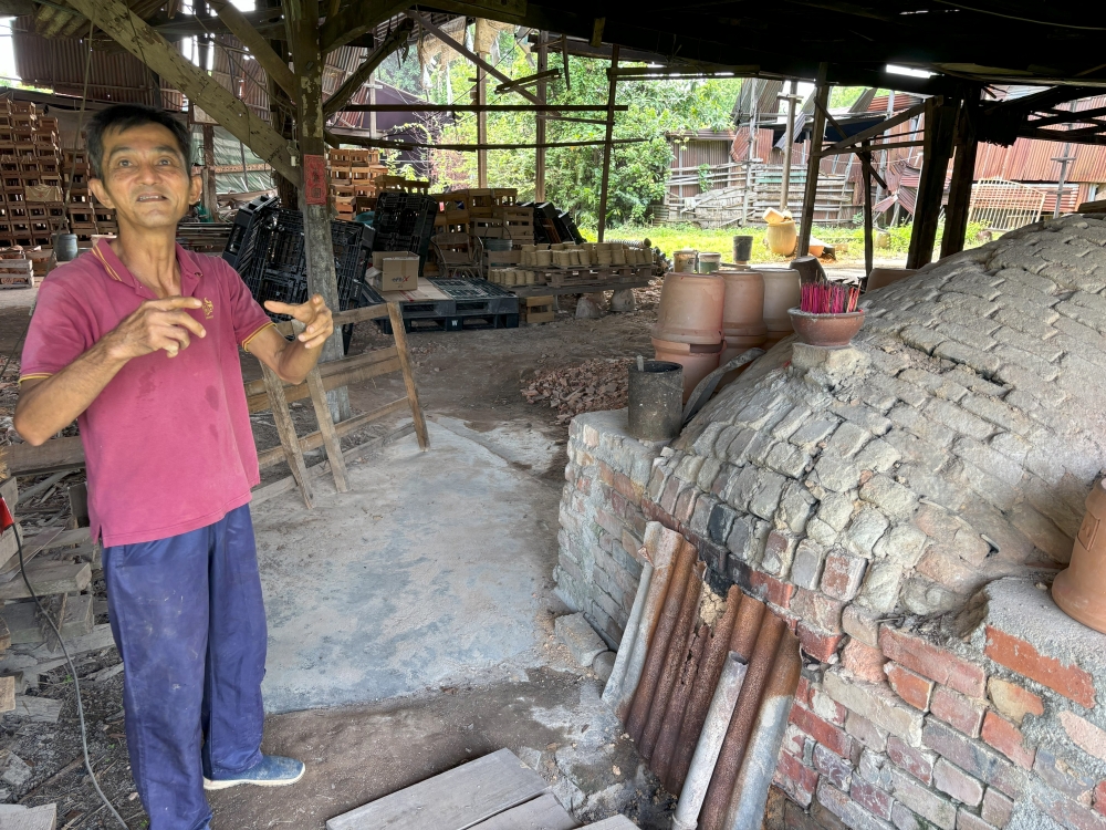 Traditional red clay stove maker Foong Cheah Thong speaks at his factory in Taman Milee, Ipoh. — Picture by John Bunyan