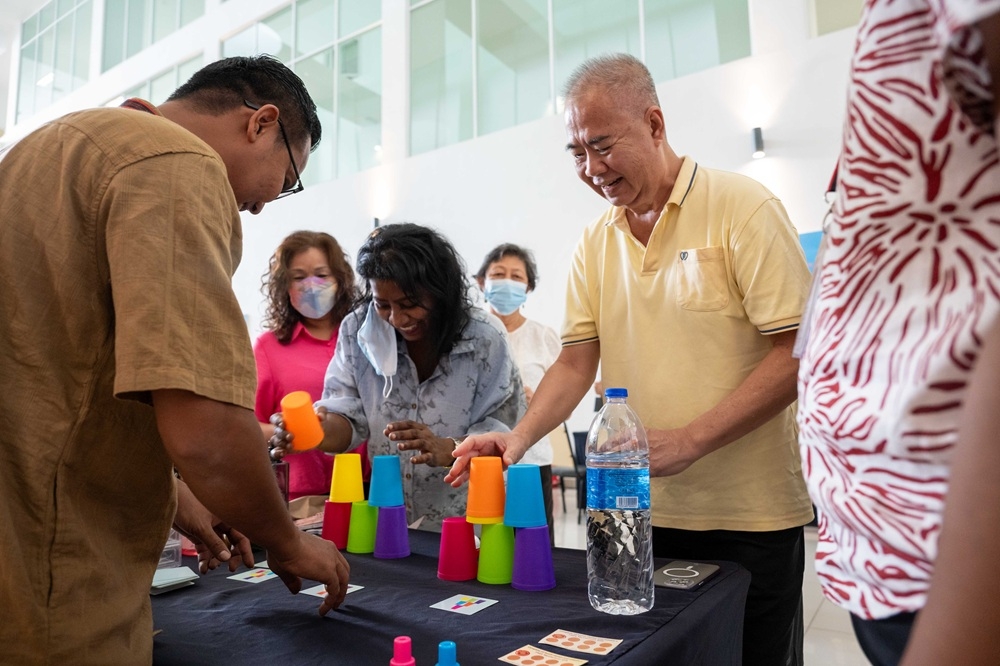 Visitors having fun at the carnival booth games. — Picture courtesy of Oriental Melaka Straits Medical Centre