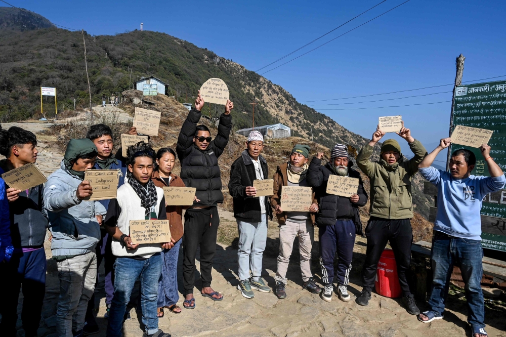 Activists protest against the construction of a cable transportation system leading to the Pathibhara Devi temple. — AFP pic