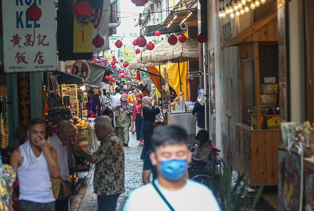 Tourists visiting Concubine Lane in Ipoh. — Picture by Farhan Najib