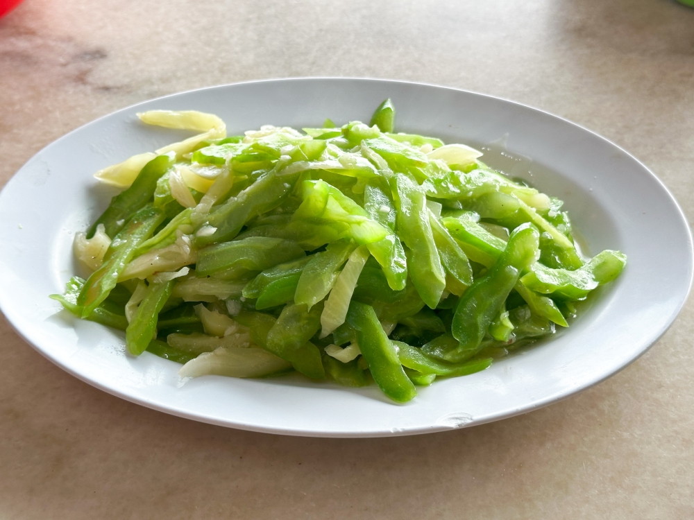 Fried Bitter Gourd with Salted Vegetable may look very simple but the combination is a refreshing one that even anti-vegetable diners may enjoy. — Picture by Lee Khang Yi