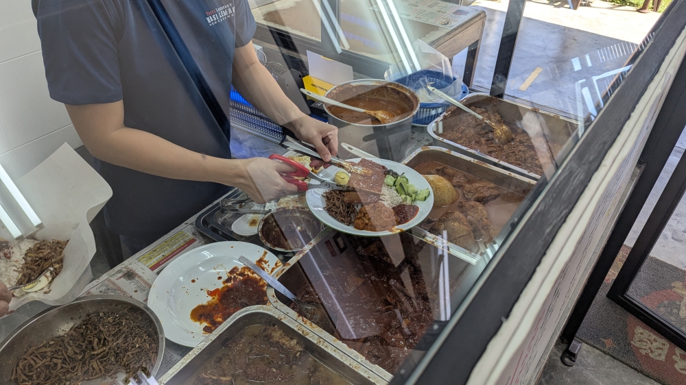 Like any other 'nasi lemak' place, once they’ve sold out of ‘lauk’, that’s all they have for the day. — Picture by Ethan Lau