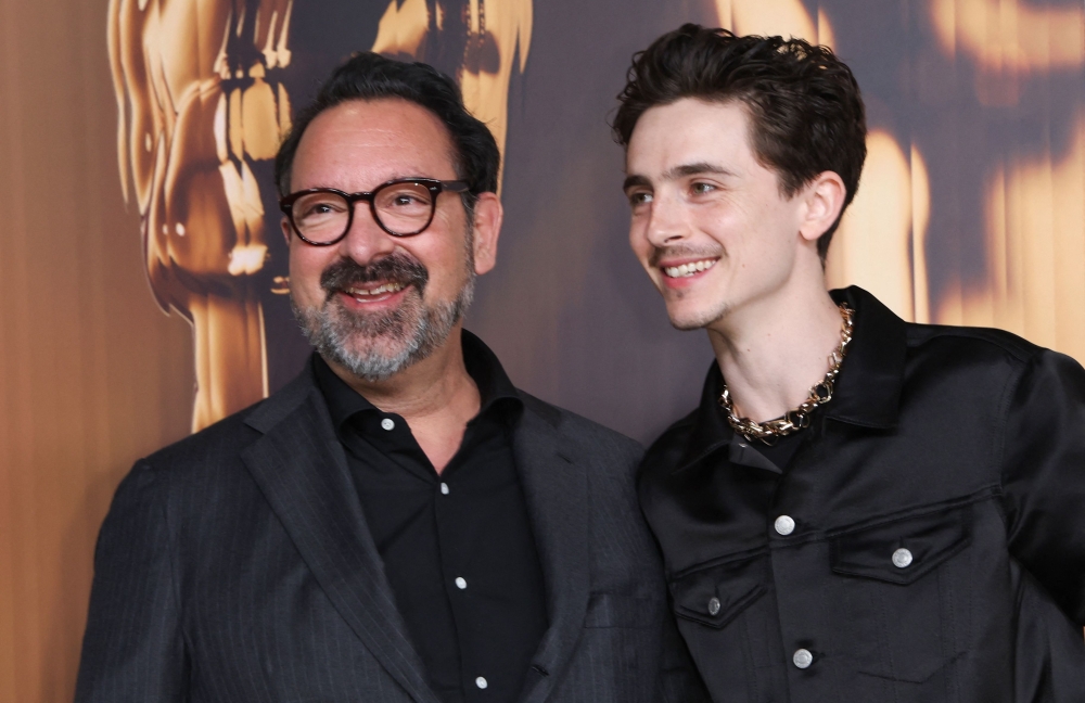 (From left) US director James Mangold and US-French actor Timothee Chalamet arrive for the 97th Annual Academy Awards Nominees Dinner at the Academy Museum of Motion Pictures in Los Angeles February 25, 2025. — AFP pic