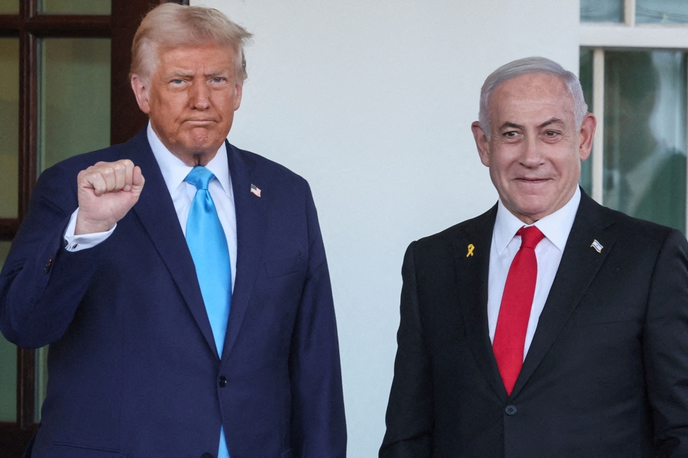 U.S President Donald Trump welcomes Israeli Prime Minister Benjamin Netanyahu at the entrance of the White House in Washington February 4, 2025. — Reuters pic  