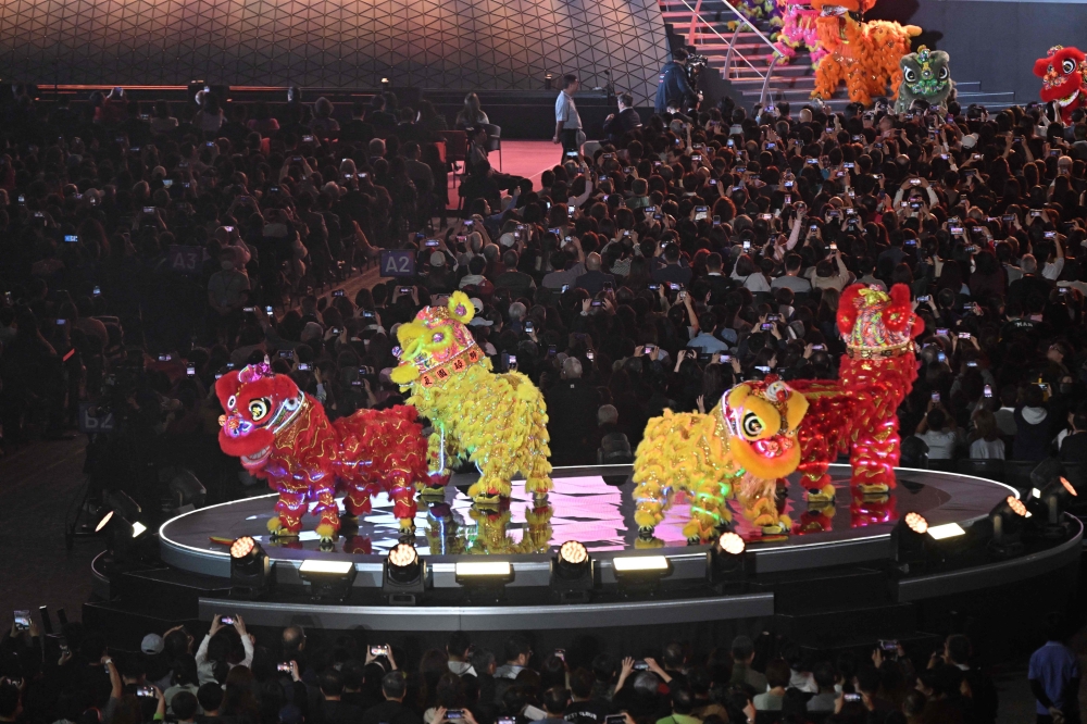 Lion dancers perform at the opening of the Kai Tak Sports Park. — AFP pic